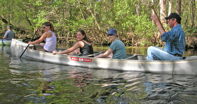 Classroom in the Wild students canoe with Prof Chris Palmer in the Florida Everglades.